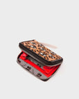 Leopard print wallet with red interior on a light gray background