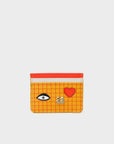 Orange cardholder with eye, heart, and skull designs on a white background