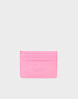 Pink cardholder with brand name on a light gray background