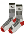 Two socks with geometric patterns and red accents on a white background