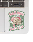 Laptop with a 'Mahjong Social Club' sticker on the back