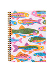 Notebook with colorful fish pattern on a white background