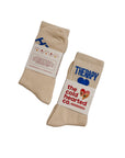 Beige socks with text and branding on a white background