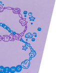 Purple and blue jewelry design on a purple background