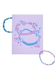 Colorful beaded bracelet on a purple card with 'GUARDING' text, against a white background