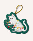 Embroidered cat ornament with Christmas lights on a green leaf-shaped background