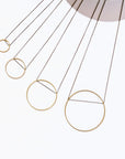 Larissa Loden Jewelry, Handmade in MN. Horizon Necklace, Geometric brass shapes threaded with delicate antiqued chain. Necklace 18 inches long with clasp.