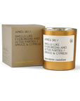 Gold candle and packaging with 'anecdote candles' branding on a white background