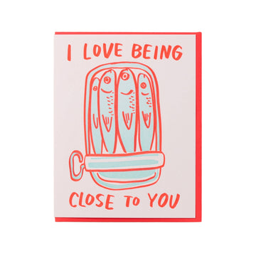 Card with fish illustration and text 'I love being close to you' on a white background