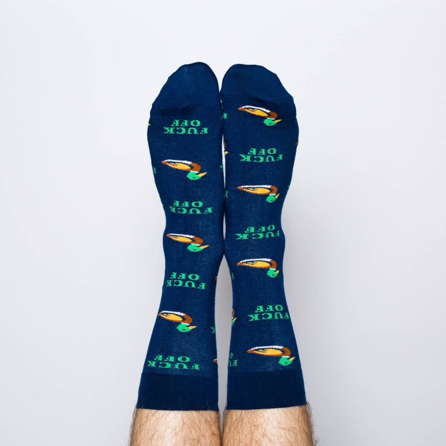 Pair of blue socks with green text and designs on a light gray background