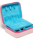 Pink and blue jewelry case with jewelry inside on a white background