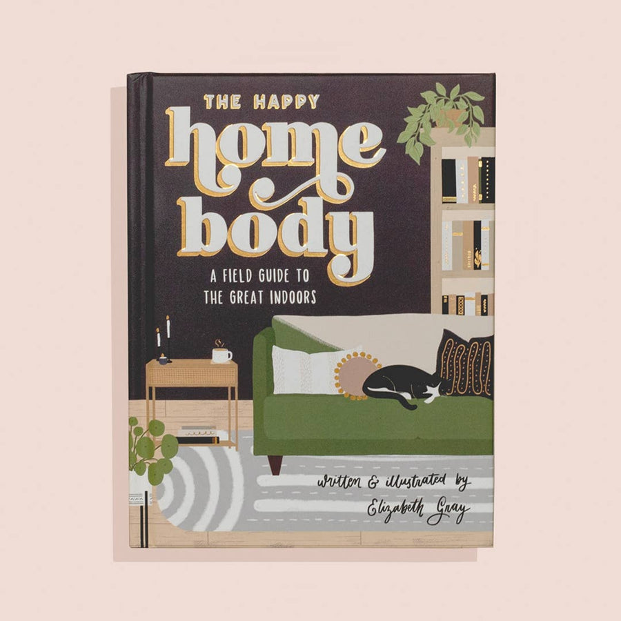 Book cover of 'The Happy Home Body' with a living room illustration on a beige background