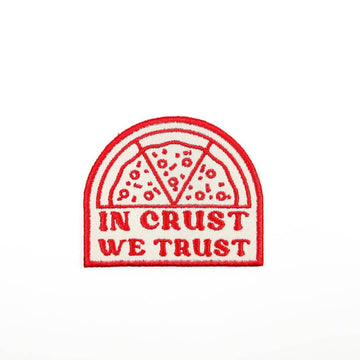 Embroidered patch with pizza design and 'In Crust We Trust' text on a white background