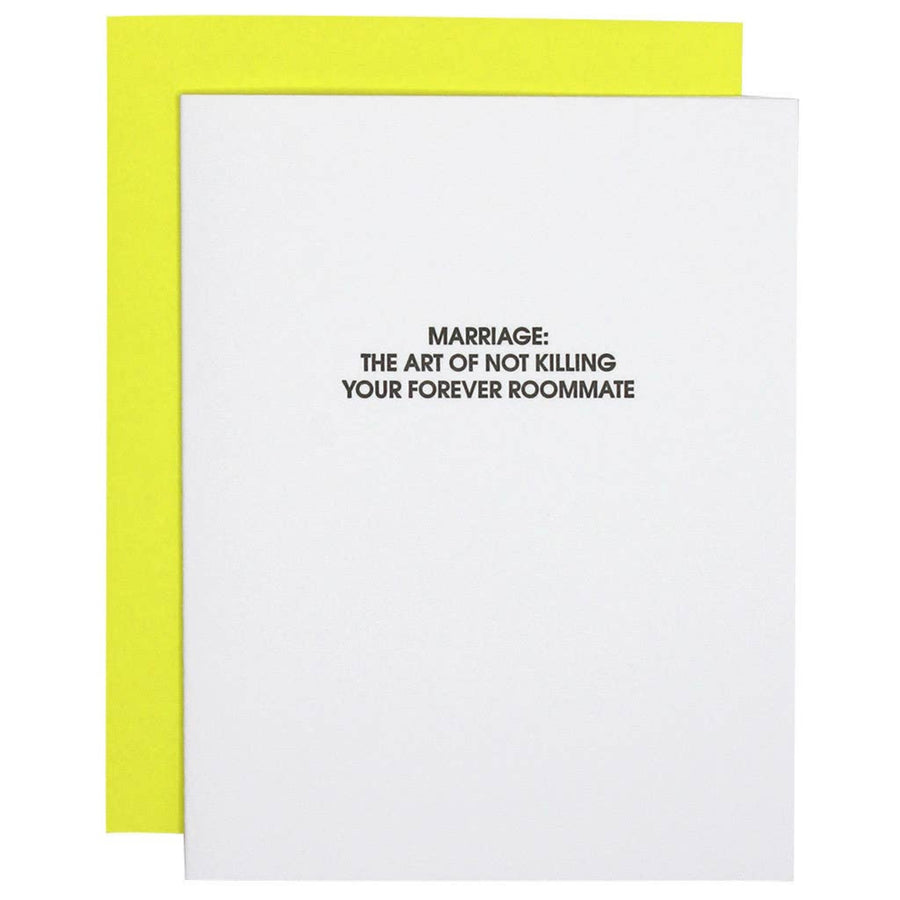 Card with text 'Marriage: The art of not killing your forever roommate' on a white background with a yellow border.