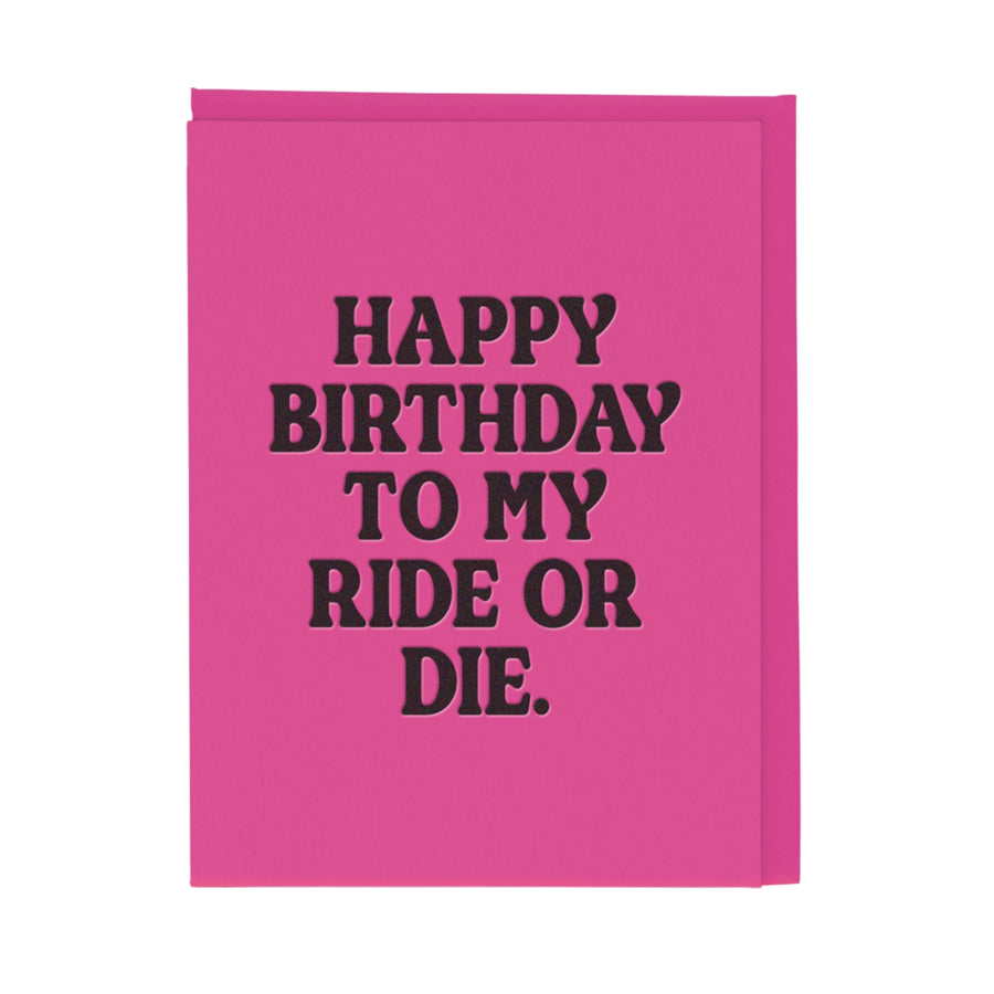 Pink card with black text 'Happy Birthday to my ride or die' on a white background