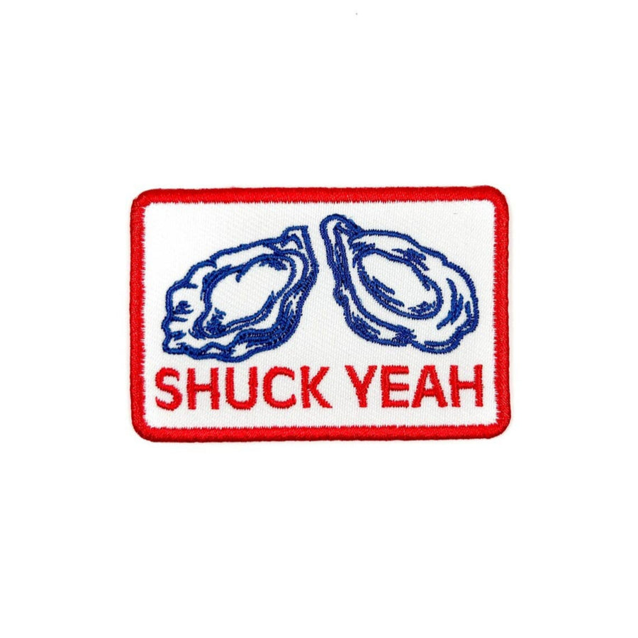 Embroidered patch with oysters and 'SHUCK YEAH' text on a white background