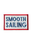 Embroidered patch with 'Smooth Sailing' text on a white background