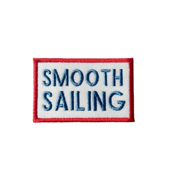 Embroidered patch with 'Smooth Sailing' text on a white background