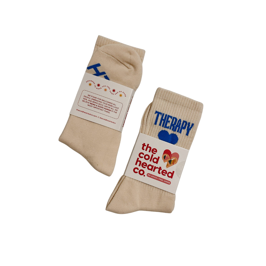 Beige socks with text and branding on a white background