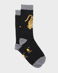 Black socks with yellow tiger design on a light gray background