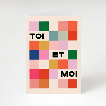 Poster with colorful square pattern and text 'TOI ET MOI' on a light background