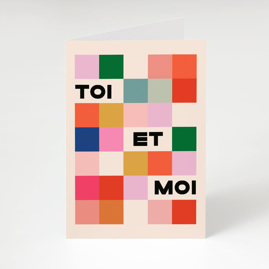 Poster with colorful square pattern and text 'TOI ET MOI' on a light background