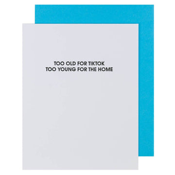 White card with blue envelope featuring text 'Too old for Tiktok, too young for the home' on a white background.