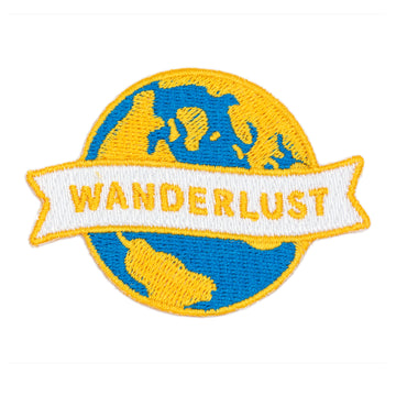 Embroidered patch with 'Wanderlust' text and blue and yellow design on a white background