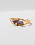 Larissa Loden Jewelry, Handmade in MN. Crystal Cuff Bracelet Gemstone pendulum wrapped into an adjustable brass cuff. Available in Amethyst, Quartz, Grey Quarts, Heihua Agate, Labradorite, Rose Quartz, Blue Lace Agate